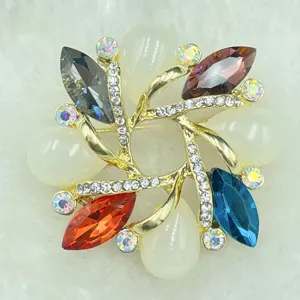 Vintage gold-tone swirl brooch with colorful marquise gems and clear rhinestones for women