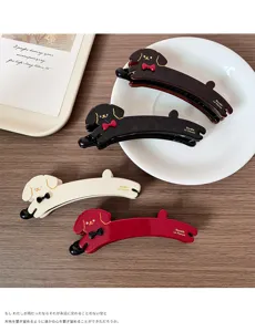 Detail view of cute puppy banana hair clips in four colors, stylish vertical hair claw.