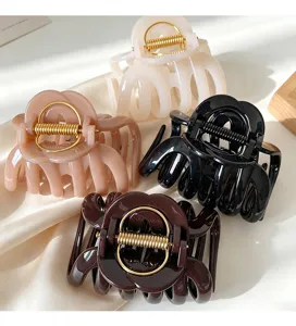 Large hair claw clips set, elegant hollow flower hair catcher with golden spring for thick hair.