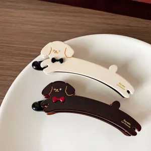 Cute dog banana hair clip for women, stylish ponytail holder and sweet hair accessories.