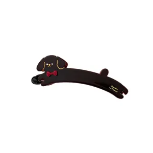 Cute dog banana clip hair accessory, brown resin hairpin with cute puppy design and bow.