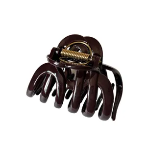 Large brown hair claw clip with golden spring for thick hair styling, solid resin daily accessory.