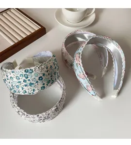 Spring floral wide headband for women, stylish pastoral fabric hair hoop for daily wear.