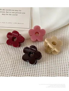 Small flower hair claw for women, cute resin shark clip, daily hair styling accessory for ladies.