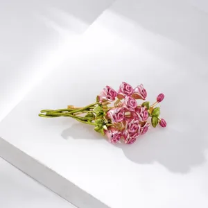 Enamel pink rose bouquet brooch detail view, elegant floral corsage accessory for women.