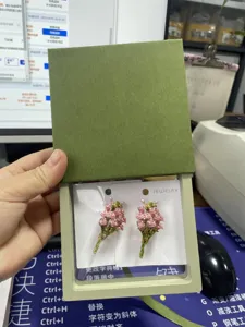 Exquisite pink rose bouquet enamel brooch pin, elegant floral suit accessories detail.