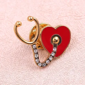 Exquisite medical stethoscope heart rhinestone brooch alloy enamel pin for nurses and doctors.