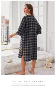 Detail view of loose grey plaid nightdress showcasing side slit, long sleeves and cozy flannel fabric.