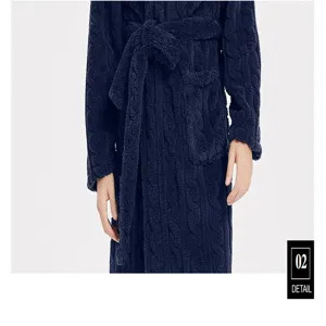 Close-up detail view of the plush navy blue fleece men bathrobe, soft textured fabric with belt.