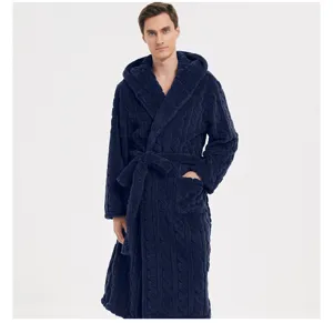 Detail view of a thick plush fleece hooded men bathrobe in dark blue with cable knit pattern.