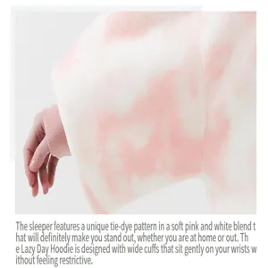 Close-up view of the cozy pink and white tie-dye wearable blanket with wide comfy cuffs.