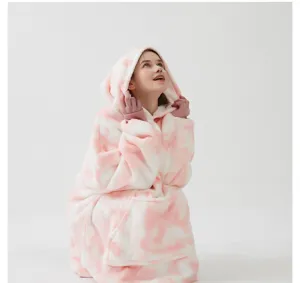 Pink white tie dye oversized hoodie blanket detail shot showcasing soft fleece fabric texture.