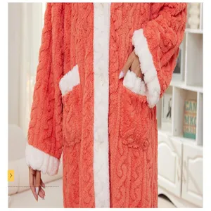 Plush fleece bathrobe detail showing fluffy white trim pocket and cozy winter nightwear fabric.