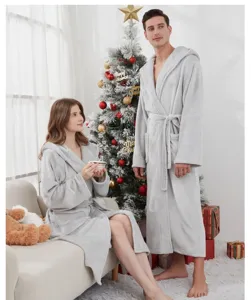 Grey plush fleece hooded couple bathrobe detail shot, warm winter sleepwear for cozy home.