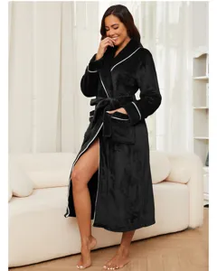 Detailed view of the cozy black fleece bathrobe featuring elegant white piping and matching waist tie.