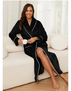 Black flannel bathrobe detail view, cozy homewear on sofa, soft winter sleepwear.
