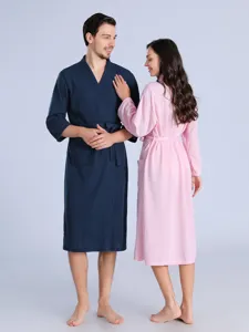 Comfortable couple waffle bathrobes in dark blue and pink, perfect for spring and summer lounging.