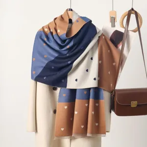 Detail view of the soft color-block heart pattern winter scarf, stylish and warm.