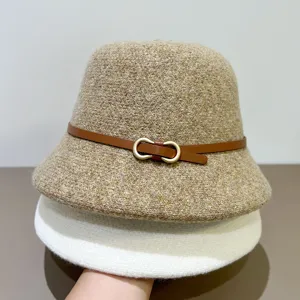 Detailed view of women autumn vintage bucket hat with belt buckle, stylish wool basin cap.