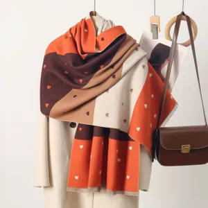 Cozy colorblock cashmere-feel scarf featuring cute jacquard hearts for autumn and winter.