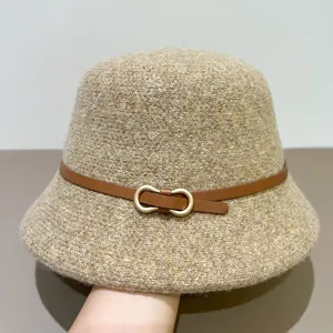 Close-up detail view of a stylish autumn womens wool felt bucket hat with brown belt and buckle
