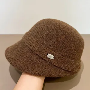 Brown knitted bucket hat detail, winter warm felt basin hat, retro casual fashion accessory.