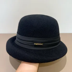 Classic black wool cloche hat for women, elegant vintage felt dome hat with ribbon detail.
