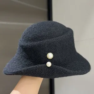 Black wool-blend roll-brim bucket hat with dual pearls, chic autumn winter fashion cap