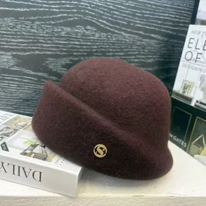 Vintage wool blend cloche hat detail, brown winter painter hat with gold S logo accent.
