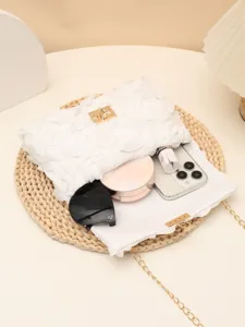 White flower evening clutch bag with gold chain strap, stylish shoulder crossbody bag detail.
