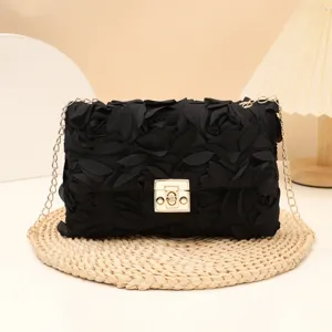 Elegant black fabric rose flower evening shoulder bag with gold chain and clasp.