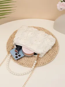 Elegant white rose evening clutch bag with pearl and metal chain strap for women.