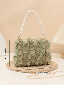 Elegant green floral evening bag with pearl top handle and gold chain strap for women.