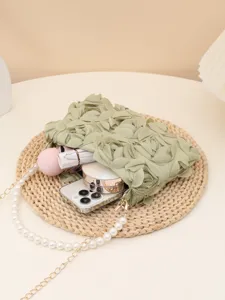 Elegant green fabric rose clutch bag with pearl chain strap for evening parties and events.