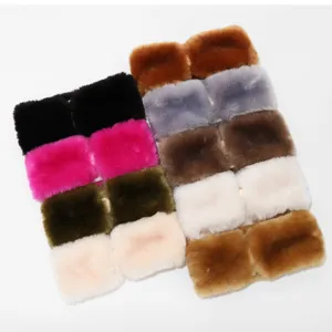 Close-up detail of soft plush wide winter headband, fluffy warm ear protection solid color hair band