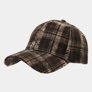Vintage brown plaid baseball cap with distressed frayed edges, casual streetwear hat.