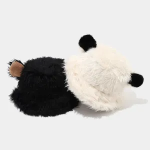 Close-up detail view of the winter plush bear ear bucket hat with soft luxury faux fur texture.