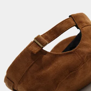 Brown suede military cap detail showing metal buckle, vintage utility flat top hat for autumn.