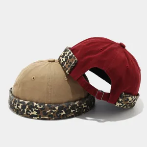 Detailed view of vintage leopard print docker cap roll brim street style trendy hat.