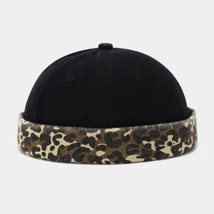 Retro leopard colorblock dockermaker hat detail, casual streetwear style unbrimmed skull cap.