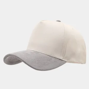Close-up detail of the beige and grey suede panel baseball cap, minimalist two-tone design.