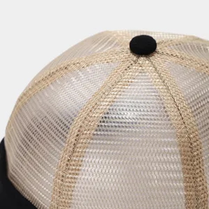 Close-up detail of breathable mesh docker cap top crown, showing textured fabric and button.