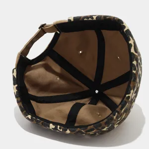 Detail view of the leopard print docker hat interior, showing neat seams and adjustable strap.