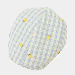 Chic plaid flat cap featuring delicate embroidered lemon details, stylish summer accessory.