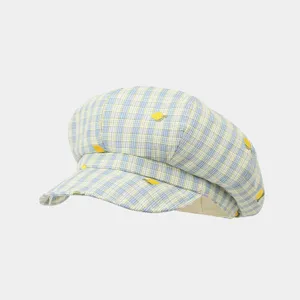 Detail view of the sweet plaid newsboy cap with cute lemon embroidery, ideal for summer daily wear.