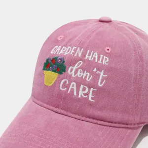 Pink washed dad hat detail, cute floral embroidery and text design, classic curved brim.