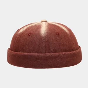 Detailed view of vintage washed denim docker cap, brimless retro miki hat with gradient color.
