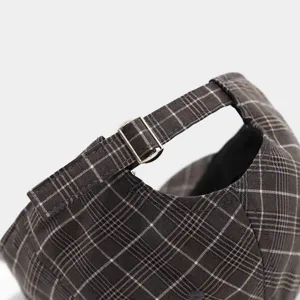 Retro plaid baseball cap detail view showing adjustable strap and metal buckle for casual wear.