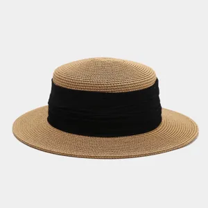 French vintage flat top straw hat detailed view, elegant black ribbon, summer beach sun wear.