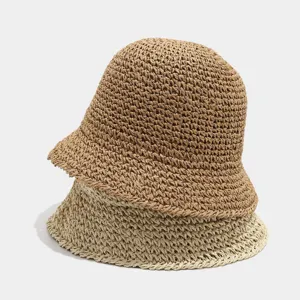 Summer straw bucket hat for women, breathable hollow woven beach sun hat in dual color stacked view.